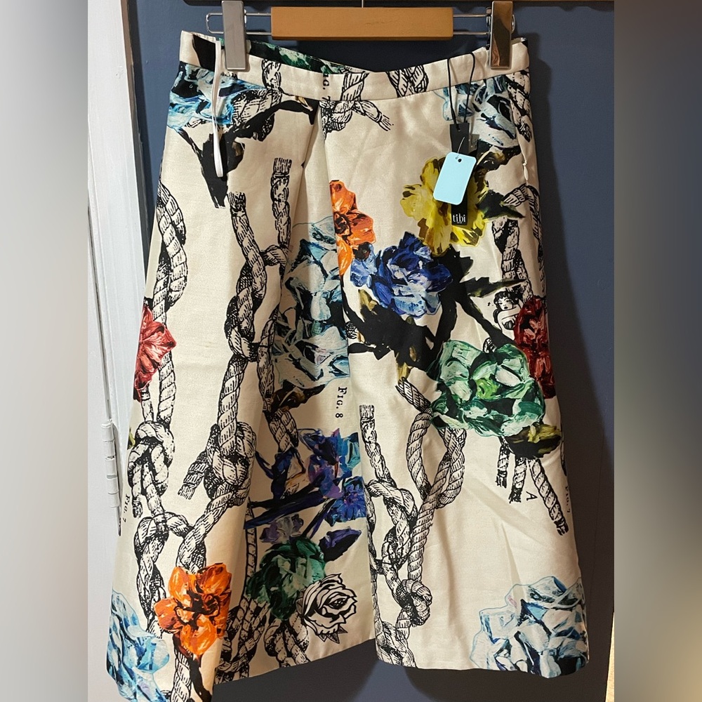New with tags 
Tibi Cream And Multicolor Floral And Rope Print Midi Skirt
Size 6
